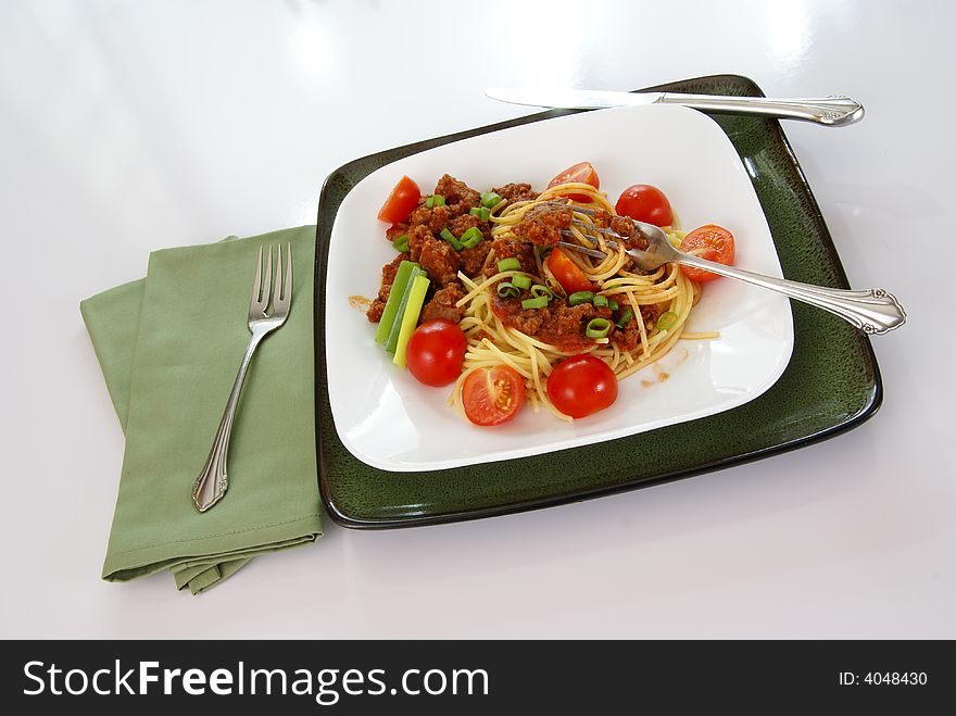 Italian spaghetti with Meat, tomato sauce, fresh tomatoes and onions.