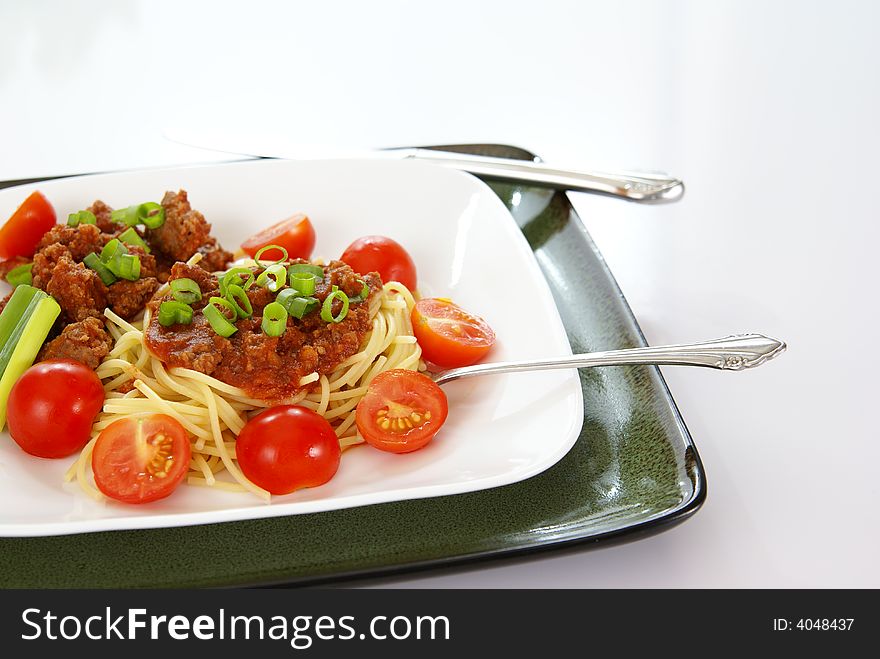 Italian spaghetti with Meat, tomato sauce, fresh tomatoes and onions.