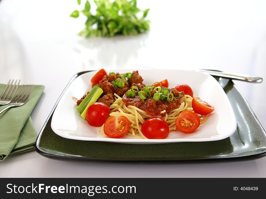 Italian spaghetti with Meat, tomato sauce, fresh tomatoes and onions.