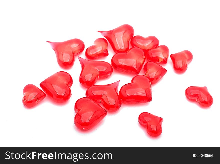 A collection of glass hearts on a white background