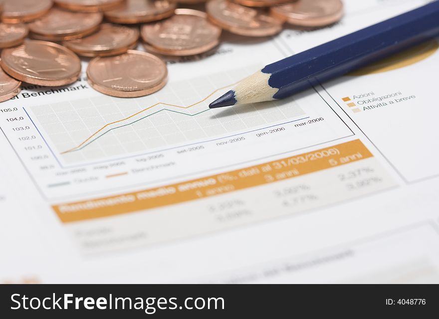 Coins pile, blue pencil and stock market graph. Coins pile, blue pencil and stock market graph