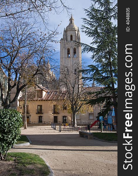 An empty Segovian Park and Church, Spain.