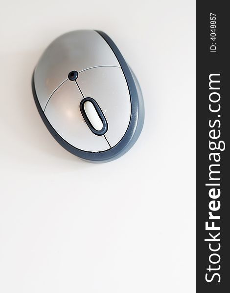 Modern silver wireless computer mouse with white background