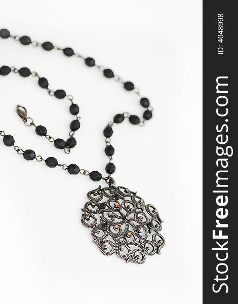 Black necklace isolated on white