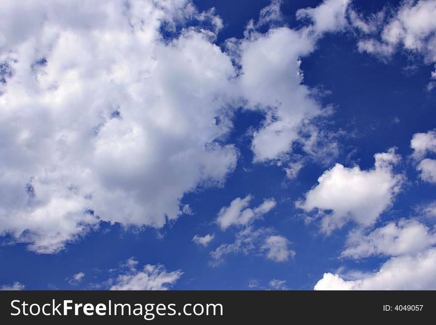 Clouds against a deep blue sky