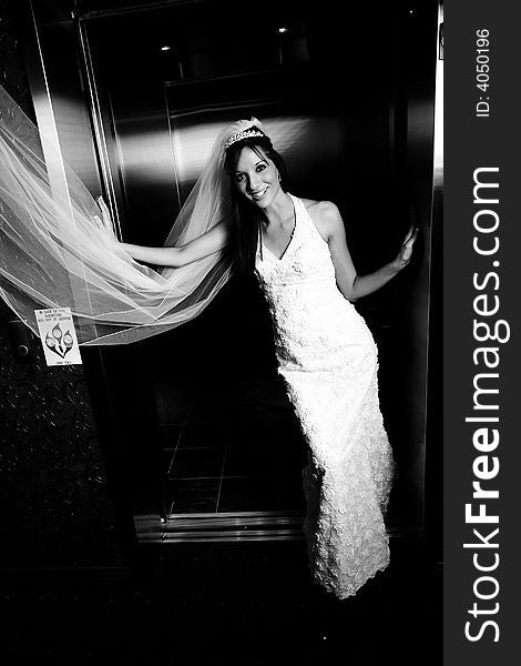 Bride standing in elevator door