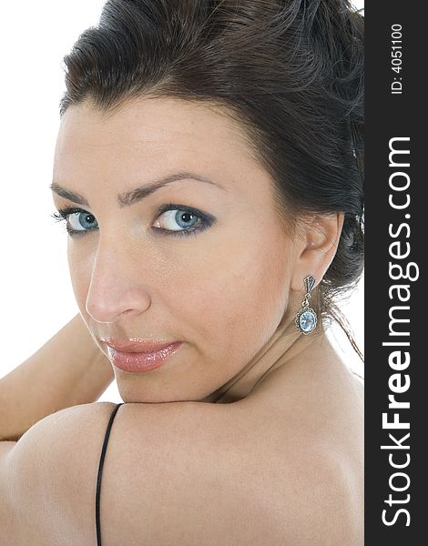 Portrait of the brunette in the evening dress on  isolated background