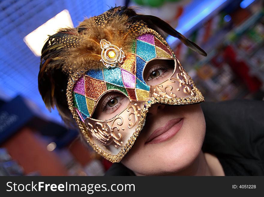 The green-eyed woman in the carnival mask. The green-eyed woman in the carnival mask