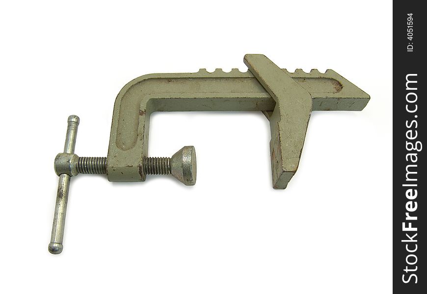 Old clamp on a white background