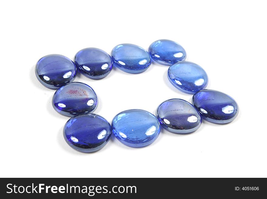 Blue glass stones isolated on a white background. Blue glass stones isolated on a white background.