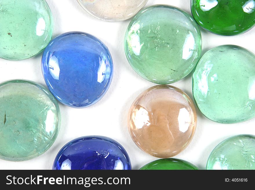 Colored glass stone isolated on a white background. Colored glass stone isolated on a white background.