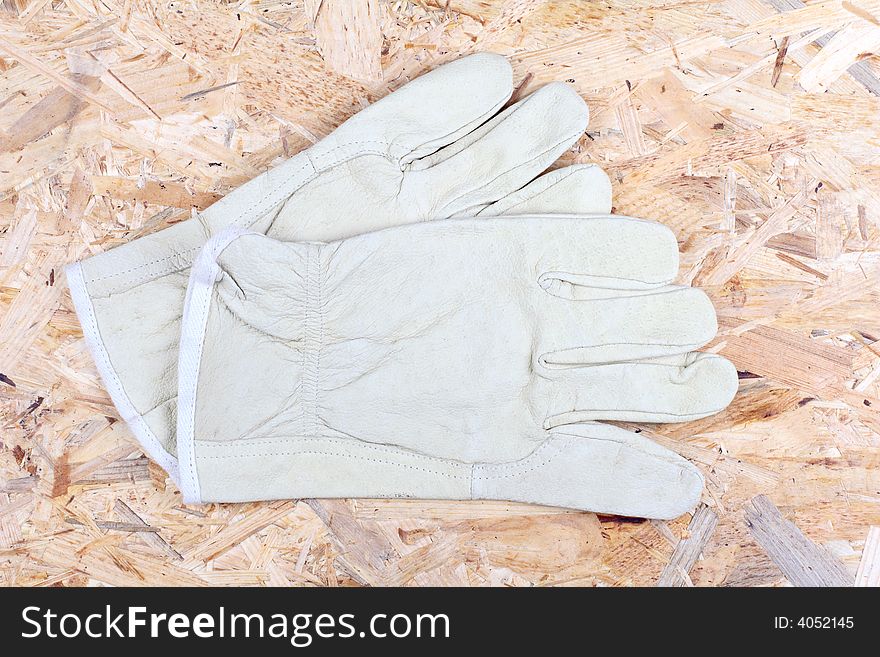 Working gloves on the wooden background