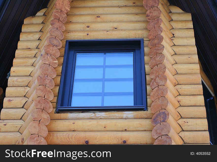 Modern window in the new wooden house