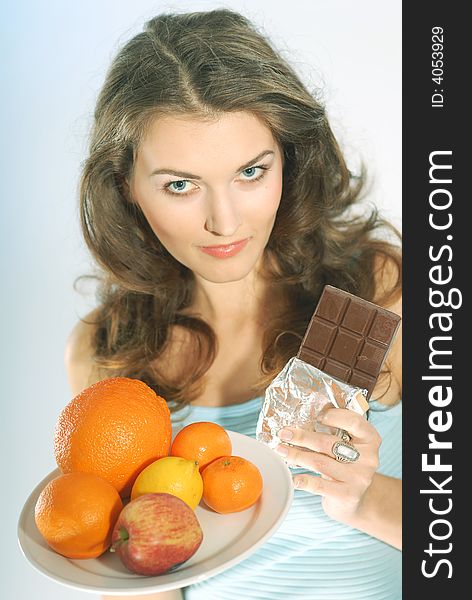 Woman with fruit and chocolate