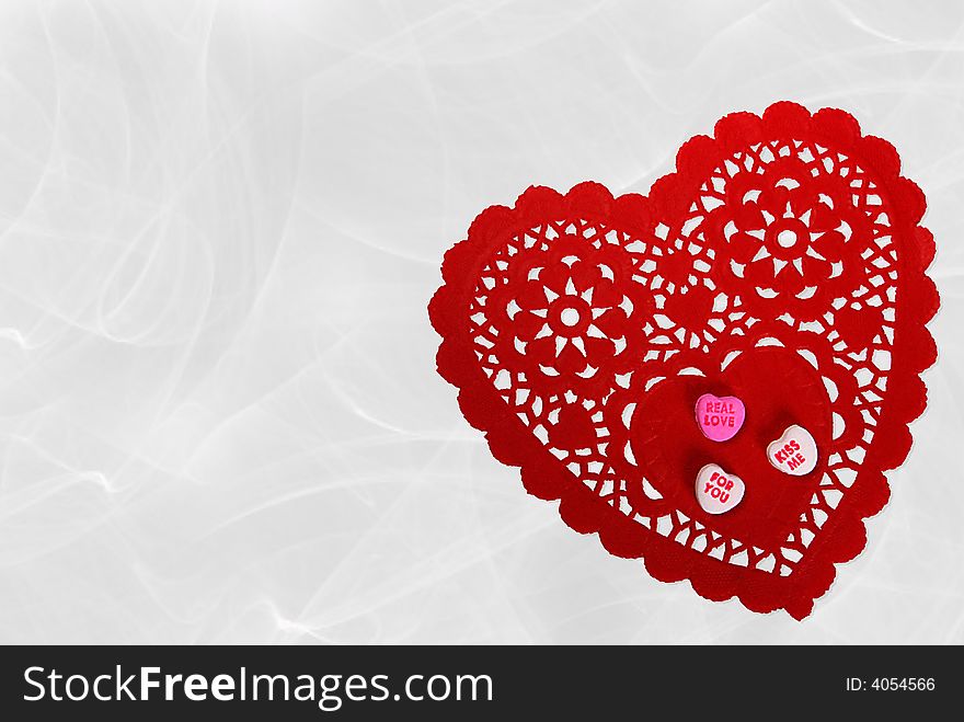Valentine candy hearts on red lace doily. Valentine candy hearts on red lace doily.