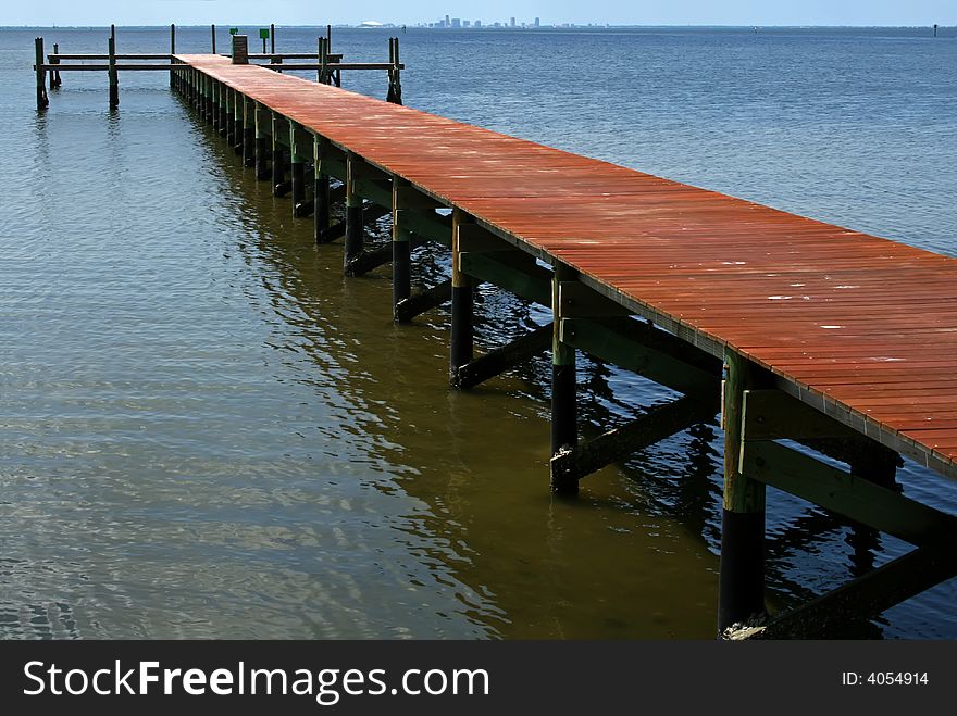 Empty old wooden dock extended out into the water