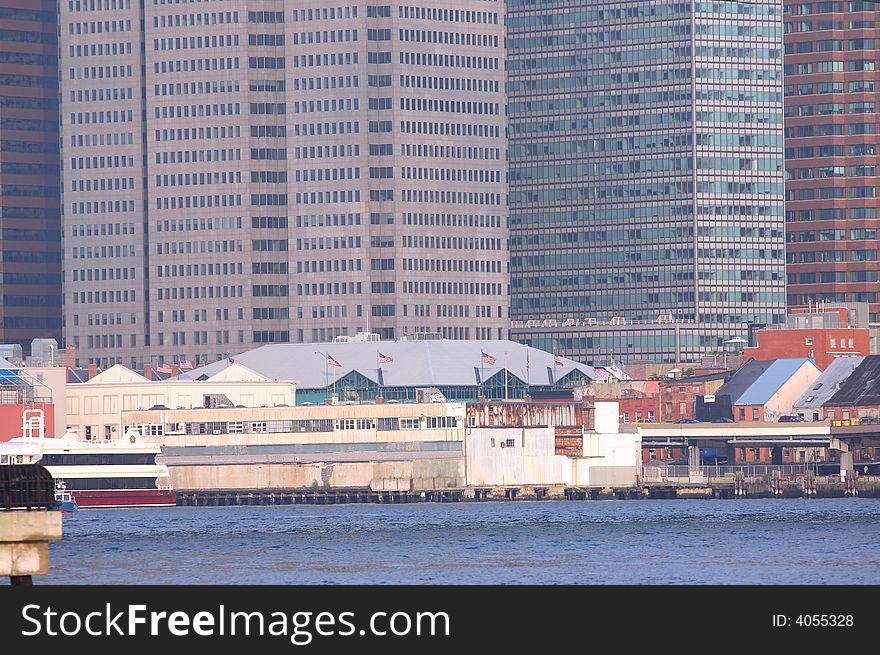 Abundant modern skyscrapers in the background at New Yorks financial district and the older part of the city on the Hudson river..
. Abundant modern skyscrapers in the background at New Yorks financial district and the older part of the city on the Hudson river..