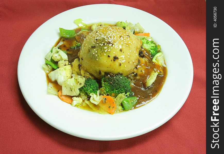 Roasted chicken with vegetables on the plate