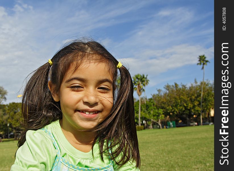 Girl Smiling while outside at the park. Girl Smiling while outside at the park