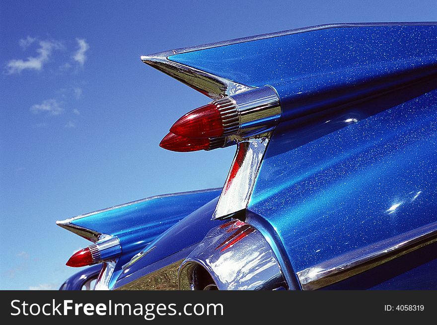 Tail lights and wings against blue sky. Tail lights and wings against blue sky