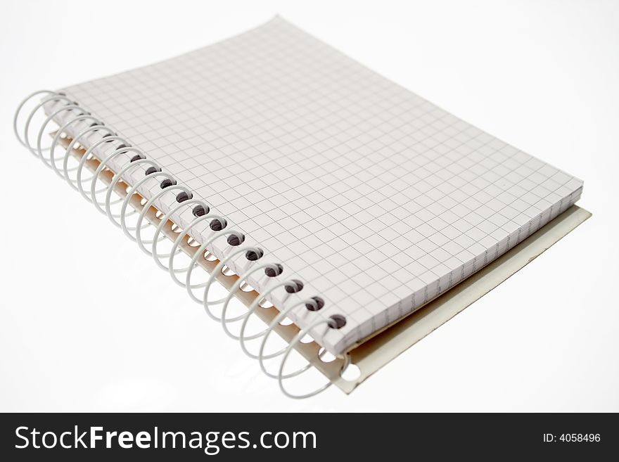 Office - spiral notebook over white.