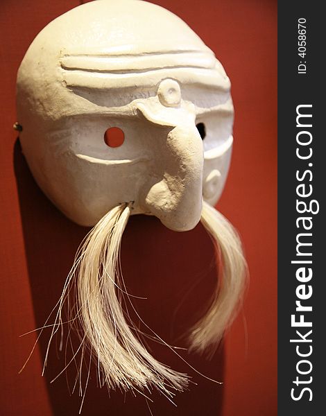Side view of a mustachioed mask