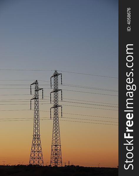 Electrical towers and wires on background sunset. Electrical towers and wires on background sunset