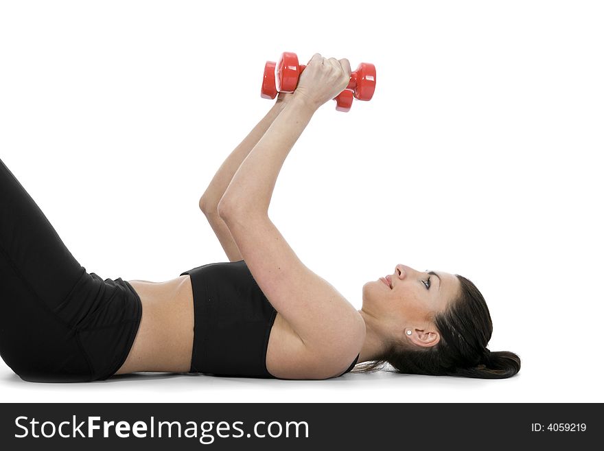 Beautiful girl with dumbbells on  isolated background