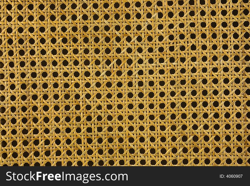 Yellow pattern detail of a wicker chair. Great background. Yellow pattern detail of a wicker chair. Great background