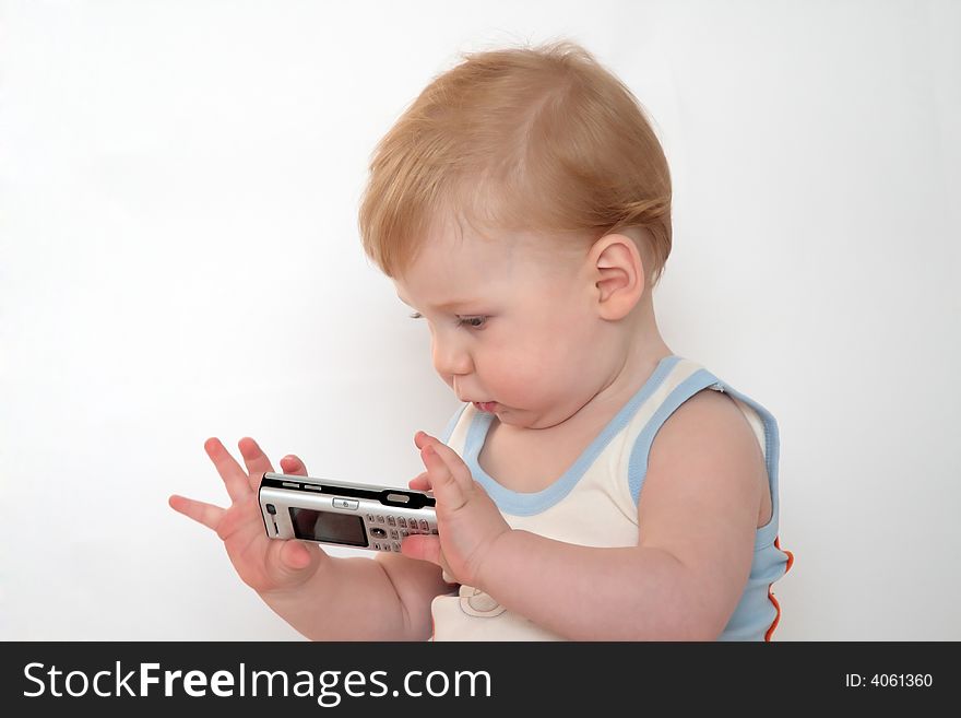 The little boy holds in hands mobile phones. The little boy holds in hands mobile phones