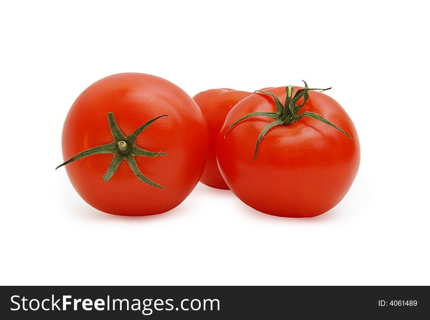 Three tomatoes on a white background