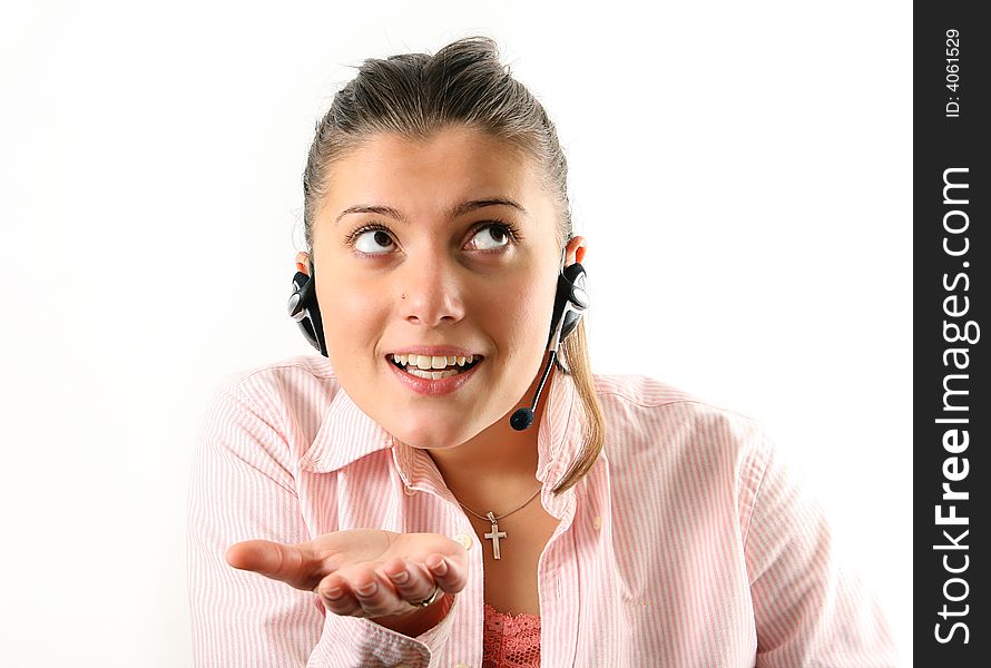 Young woman working as customer service in rose shirt with microphone