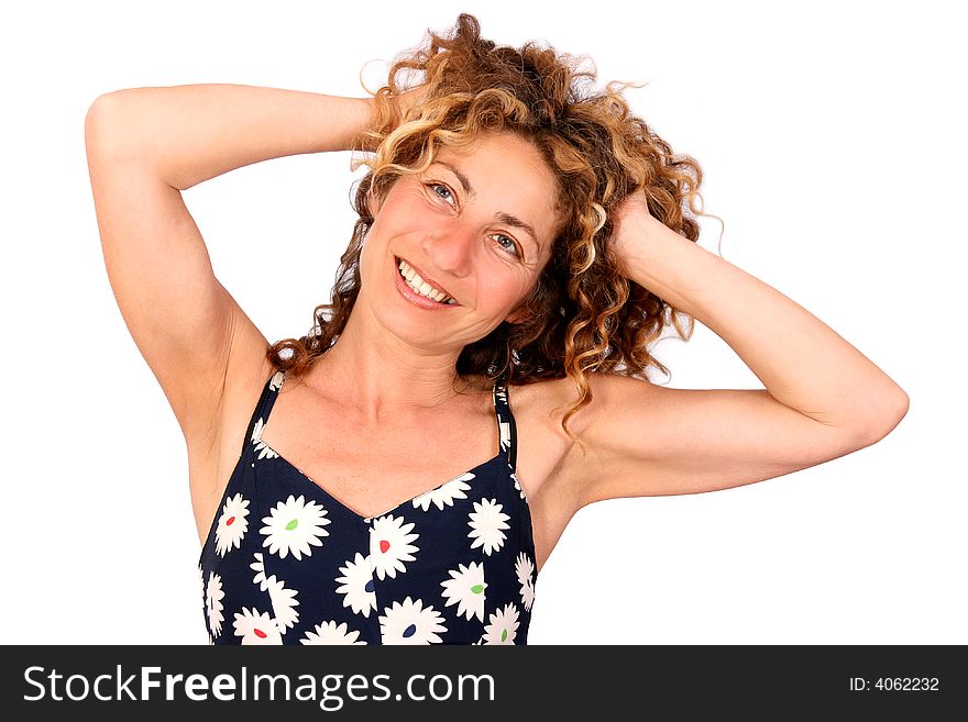 Beautiful woman in a summer-dress feeling happy and free. Beautiful woman in a summer-dress feeling happy and free.