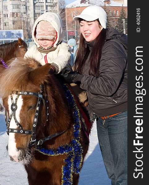 Mother and son at the horse walk