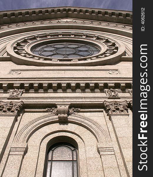 Outside view of round and arched church windows. Outside view of round and arched church windows