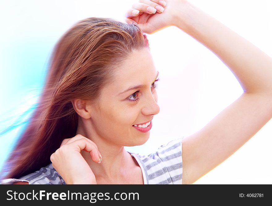 High-key portrait of young smiling woman on color back. High-key portrait of young smiling woman on color back.