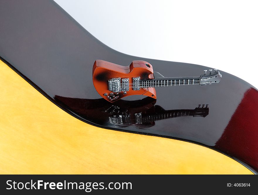 A small guitar isolated on white background