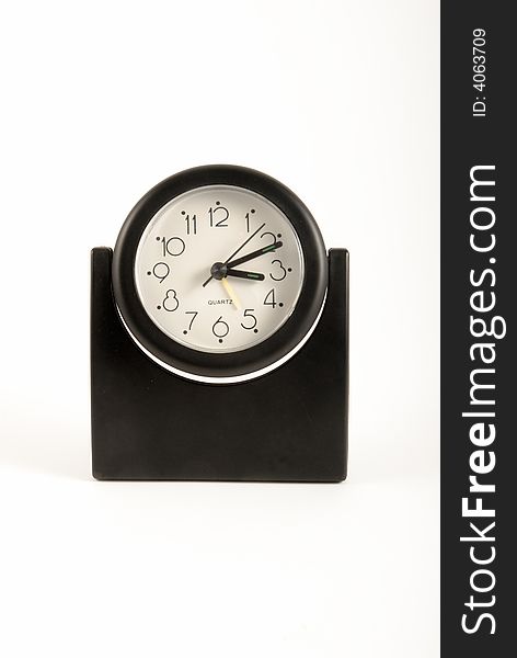 A black clock on isolated white blackground