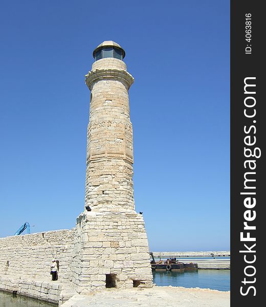 Lighthouse in old Venetian harbour in Rethymnon, Greece. Lighthouse in old Venetian harbour in Rethymnon, Greece