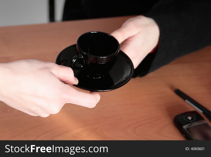 Hands Hold A Coffee Cup