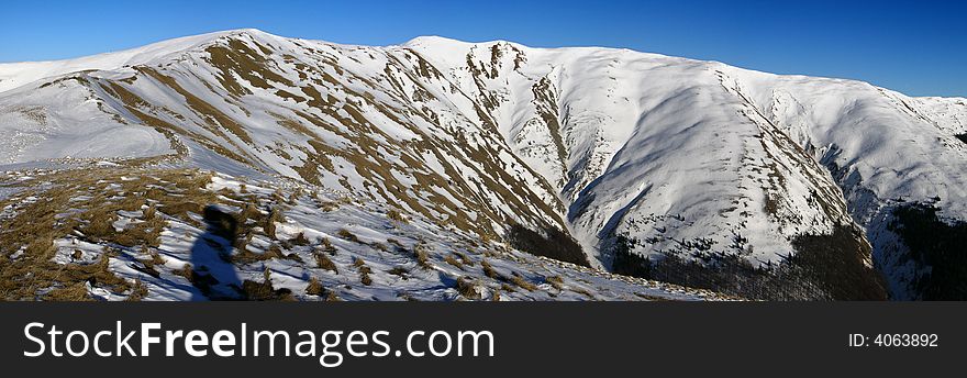 The summit Baiul Mare, is the highest peak of Baiului Mountains (near Bucegi). It is formed from three peaks, with 1890, 1891 and 1895 meters altitude, ian Carpathian Mountains, Romani. The summit Baiul Mare, is the highest peak of Baiului Mountains (near Bucegi). It is formed from three peaks, with 1890, 1891 and 1895 meters altitude, ian Carpathian Mountains, Romani