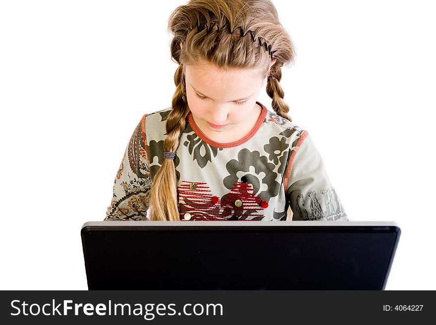 Studio portrait of a young blond child with a notebook looking concentrated. Studio portrait of a young blond child with a notebook looking concentrated