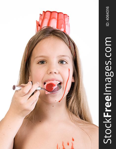 Blond child with desert on her head eating
