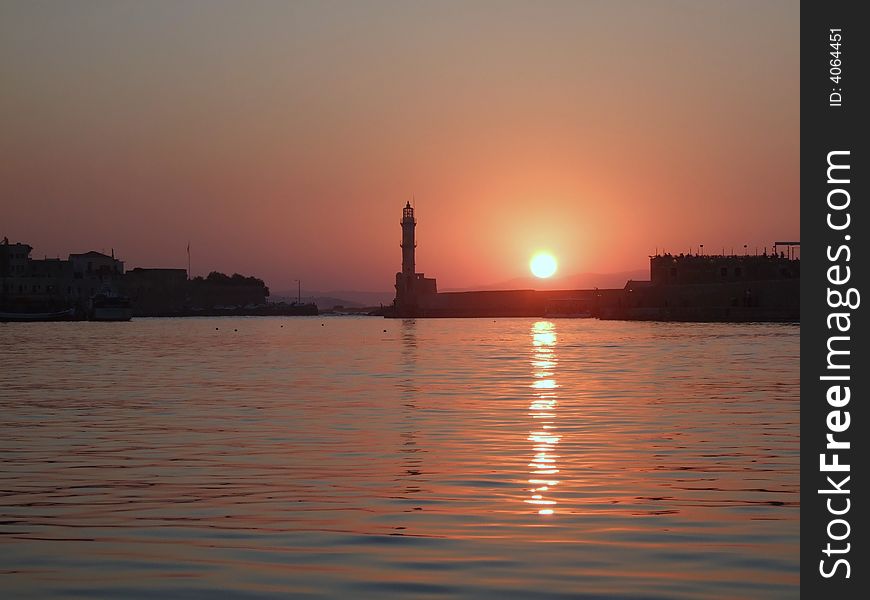 Sunset in Chania, Greece. Old Venetian port with lighthouse