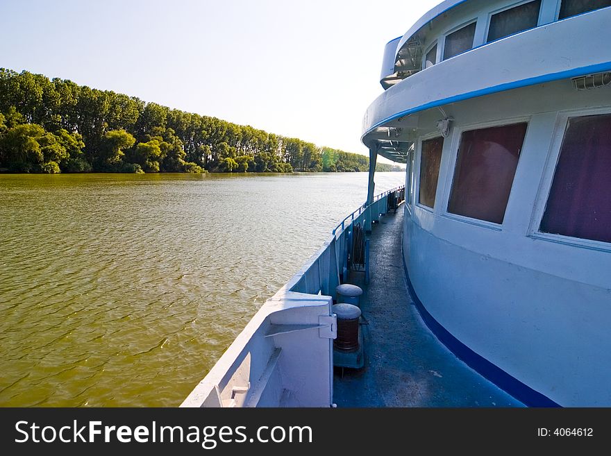 Ship cruising on large river