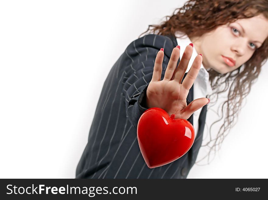 The young girl in a business suit holds heart. The young girl in a business suit holds heart