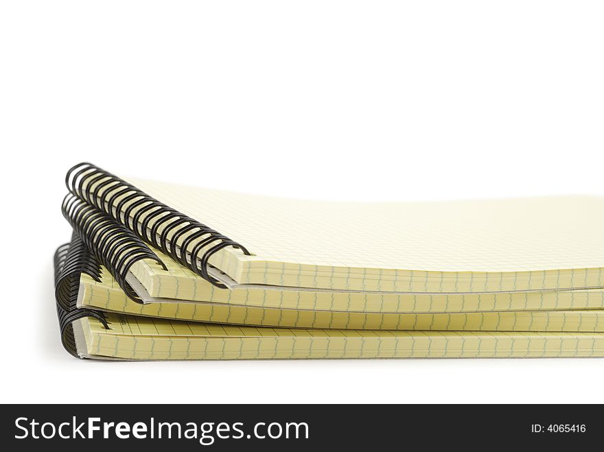 Pile of spiral notebooks isolated over white background. Pile of spiral notebooks isolated over white background