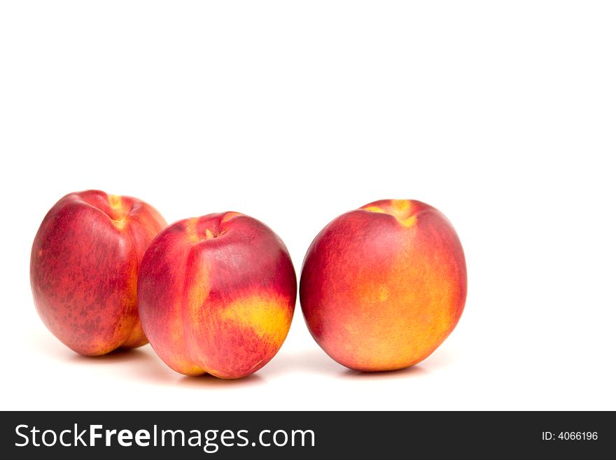 Three peaches isolated on white, one cut in health. Three peaches isolated on white, one cut in health