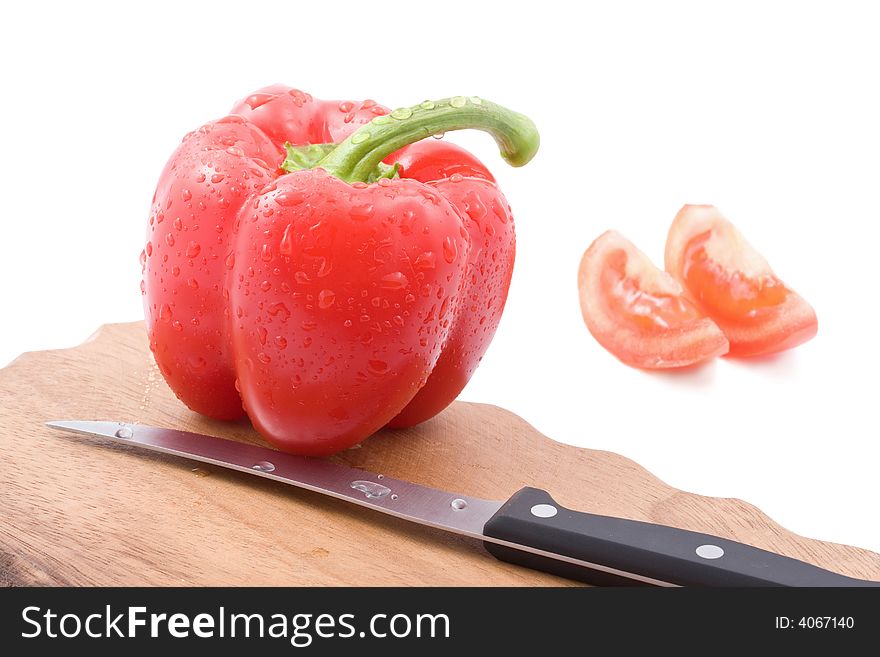 Red paprica, tomatos and knife isolated. Red paprica, tomatos and knife isolated