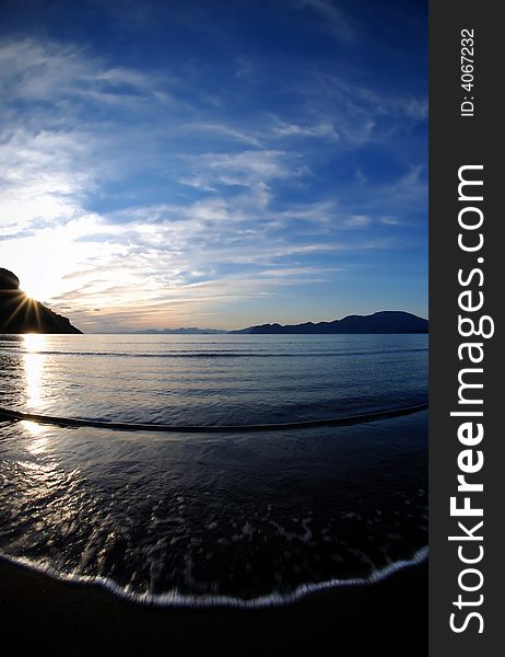 Fisheye lens and slow shutter speed, sunset in Iztuzu beach,Turkey,. Fisheye lens and slow shutter speed, sunset in Iztuzu beach,Turkey,